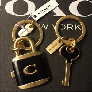 Coach Black and Gold Keychain with Lock Charm